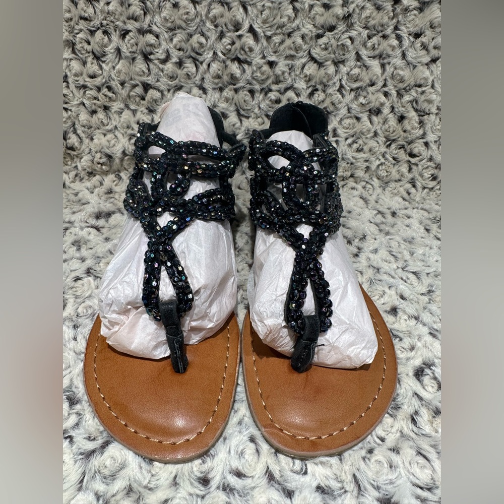 Justice. Brand New. Thong sandal. Black iridescent beaded body. Girls US 3